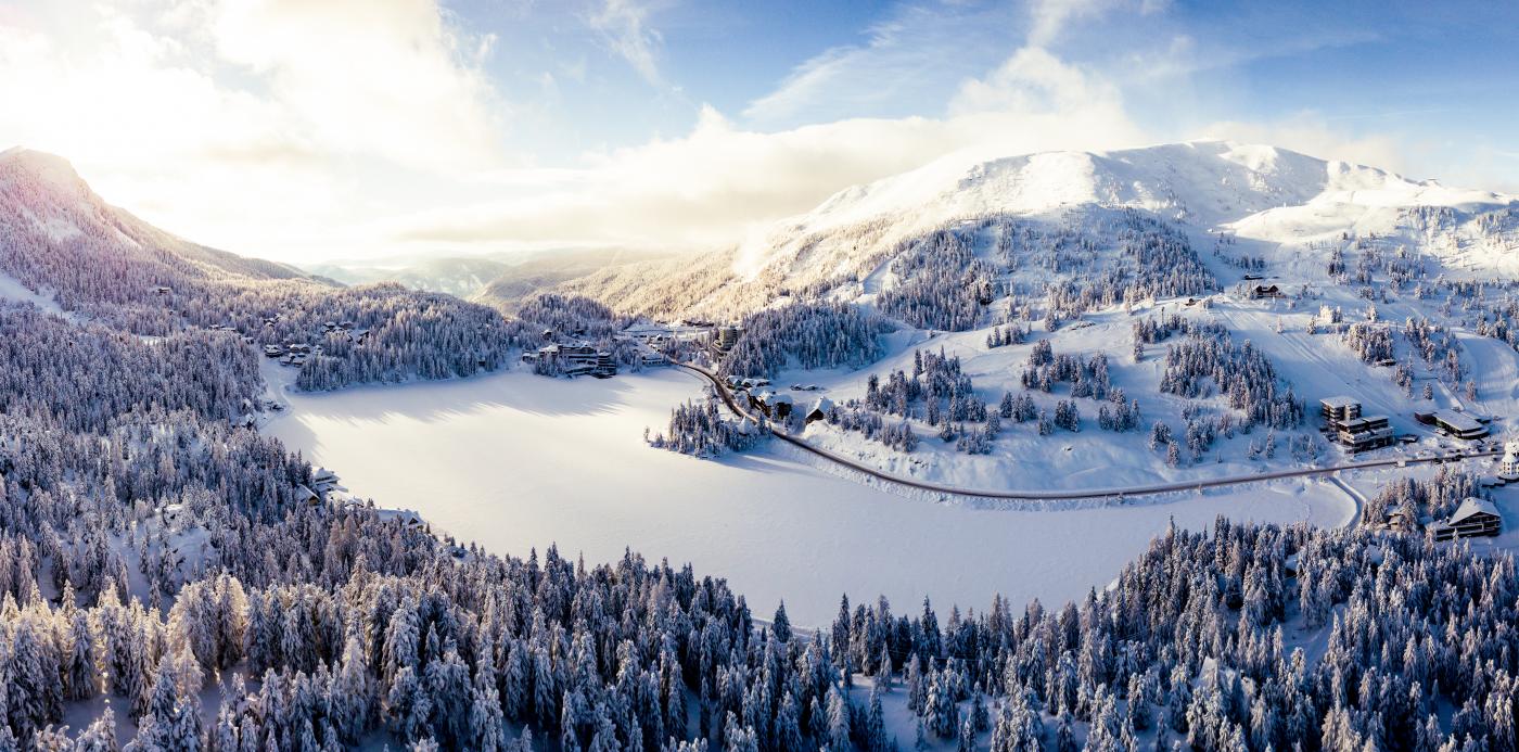 Turracher Höhe in Austria: an aerial view of a ski resort surrounded by snow.