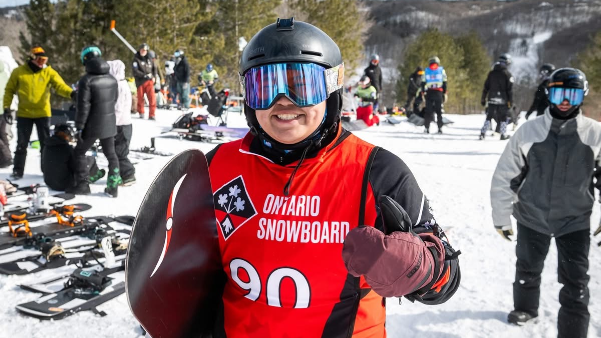 Mont Ste-Marie in Canada - a man in a red shirt and goggles stands in the snow.