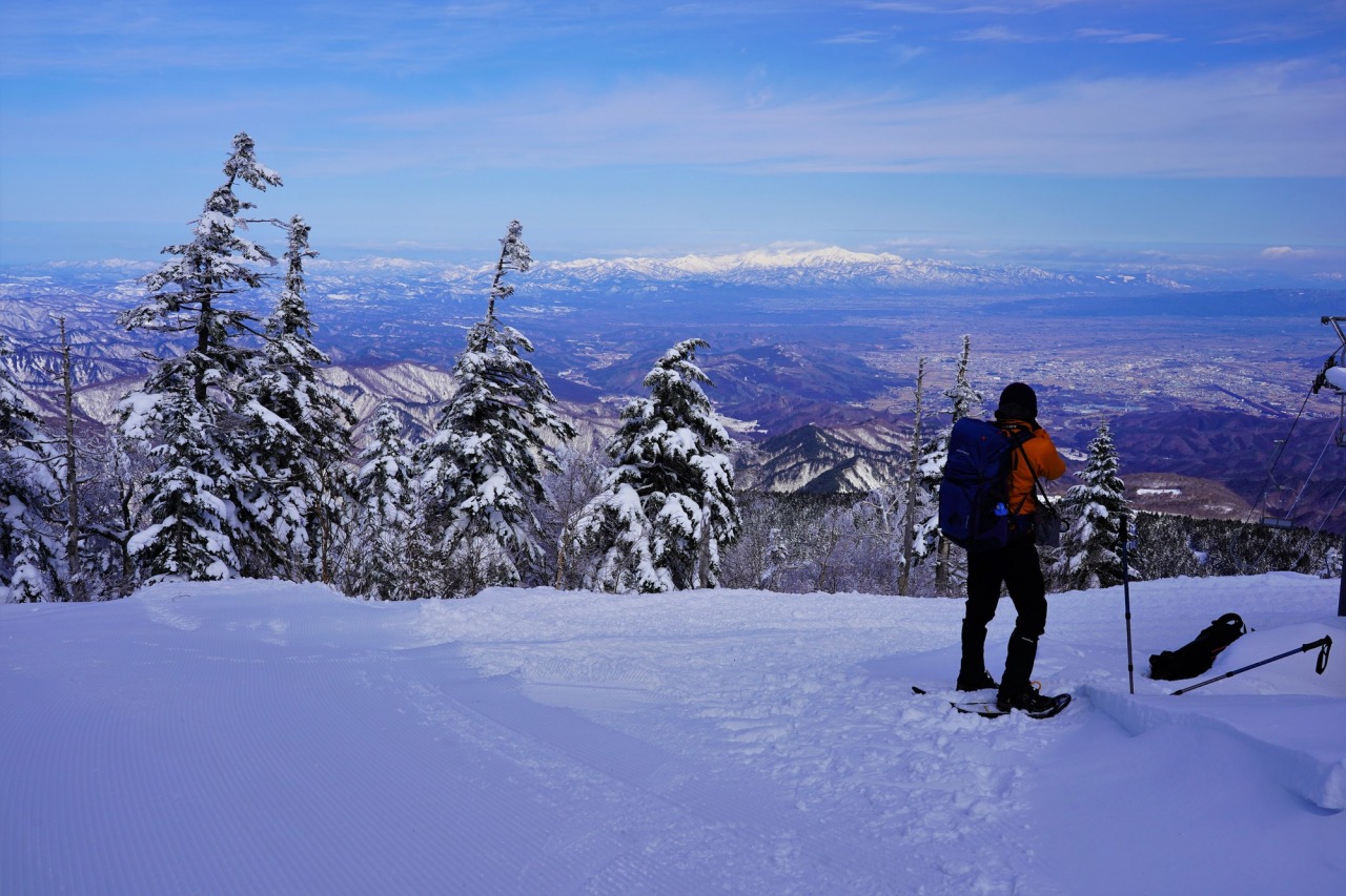 Tengendai in Japan - a person standing on top of a snow covered mountain.