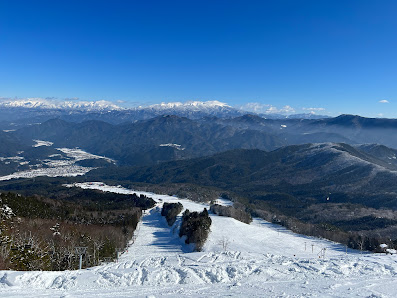 Winter sports scene at Hida Funayama Snow Resort Arkopia in Japan featuring a ski resort chalet and picturesque winter scenery.