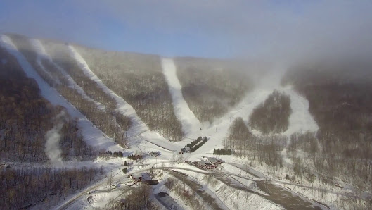 Ski resort in Plattekill, The Catskills, Roxbury, NY with snow-covered slopes, a ski lift, and stunning winter scenery for a perfect winter sports scene.