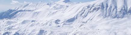 Image of a charming chalet nestled in the snowy scenes of Céüze 2000 in Gap, Hautes-Alpes, France. The snow-covered slopes and mountains provide the backdrop to a serene winter sports scene.