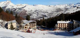 View of the Céüze 2000 ski resort in Gap, Hautes-Alpes, France, featuring a charming chalet and bustling winter sports scene amidst a beautiful winter landscape.