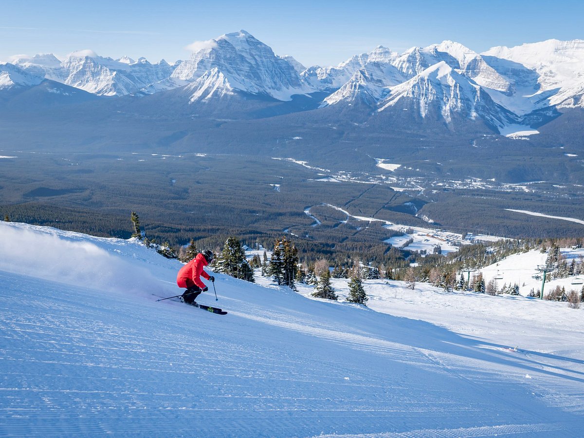 Lake Louise in Canada - a person skiing down the side of a mountain.
