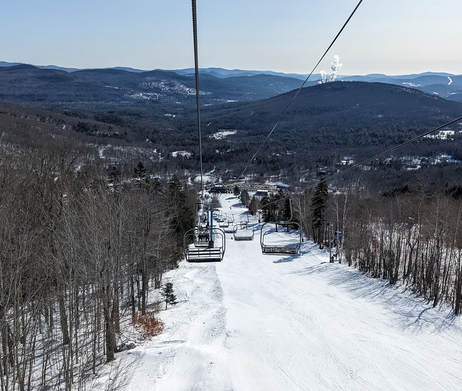 Black Mountain of Maine in USA - a ski lift going down a snowy slope.