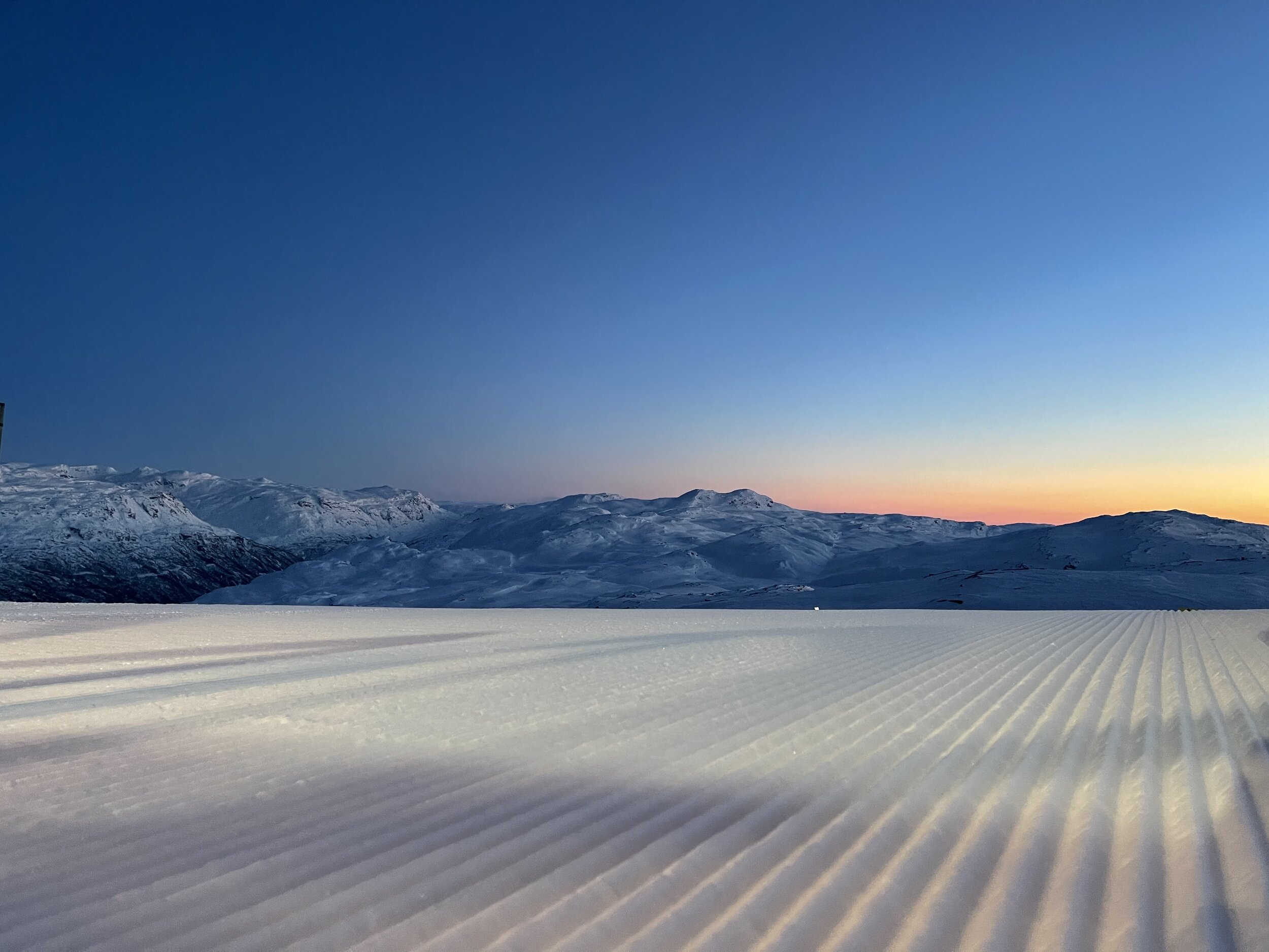 Røldal in Norway - a snow covered ski slope with mountains in the background.