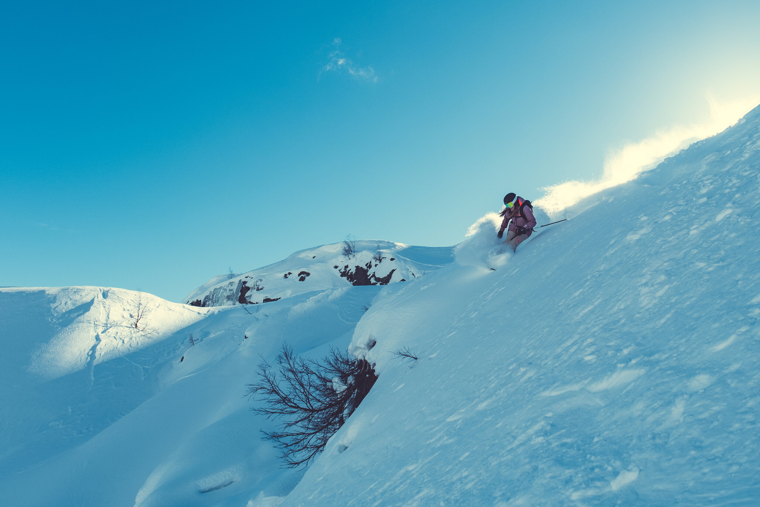 Røldal in Norway - a person is skiing down a snowy hill.