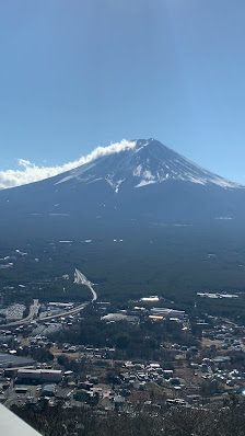 View of Fujiten Snow Resort on a bright day, showcasing the majestic mountain covered in snow, located in Yamanashi, Japan.