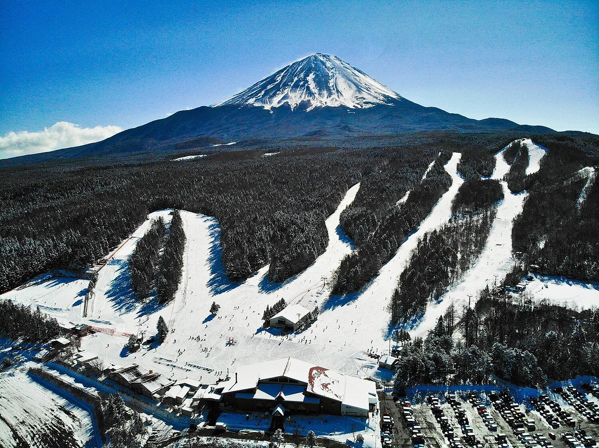 Fujiten Snow Resort in Japan: a snow covered mountain with a ski resort in the background.