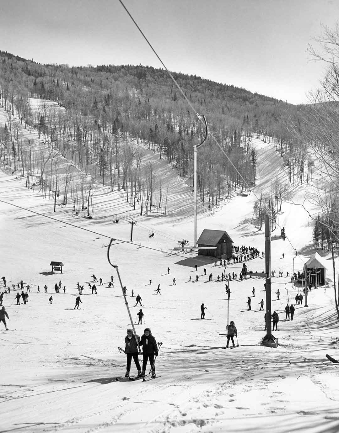 The Balsams in USA - black and white photo of people skiing on a mountain.