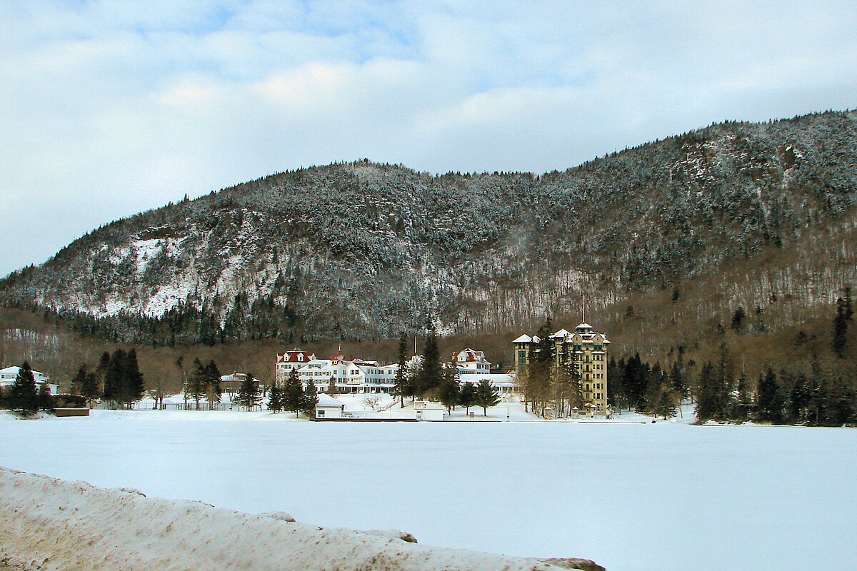 The Balsams in USA - a large body of water surrounded by snow covered mountains.