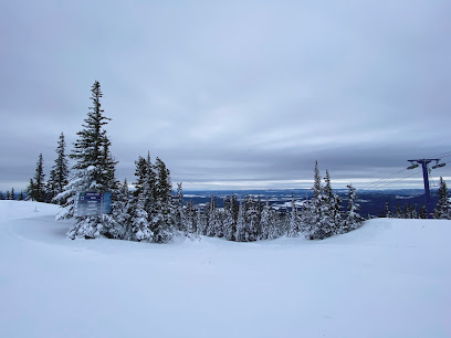 Winter sports scene at Murray Ridge in Fort St James, British Columbia. Stunning winter scenery backdrop featuring a mountain and a ski resort.
