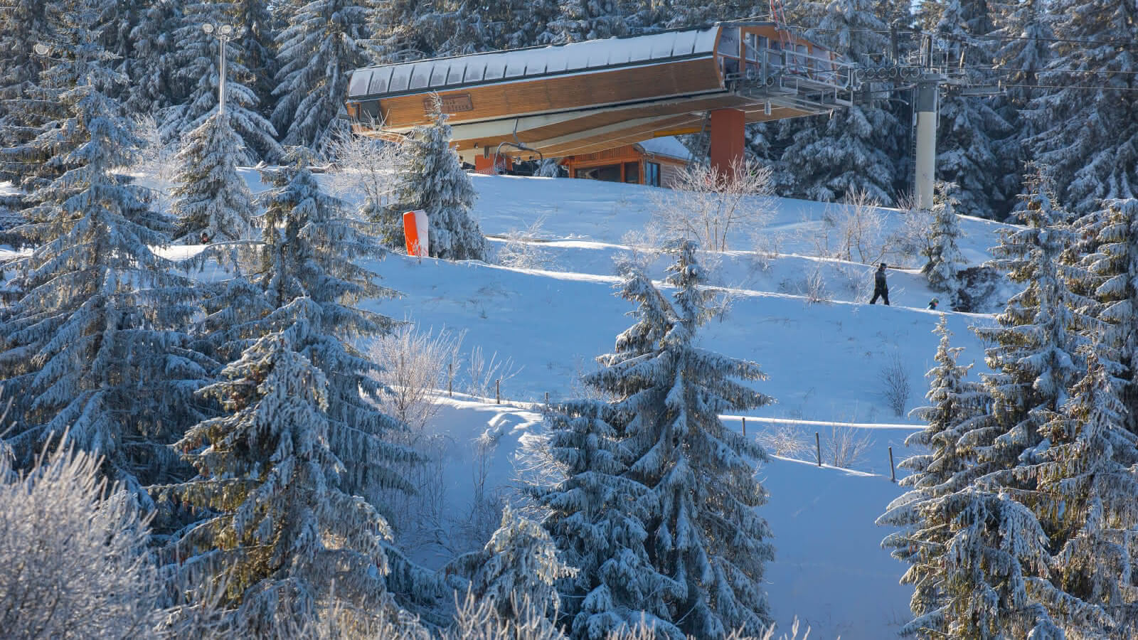 Lac Blanc in France - the trees are covered in snow.