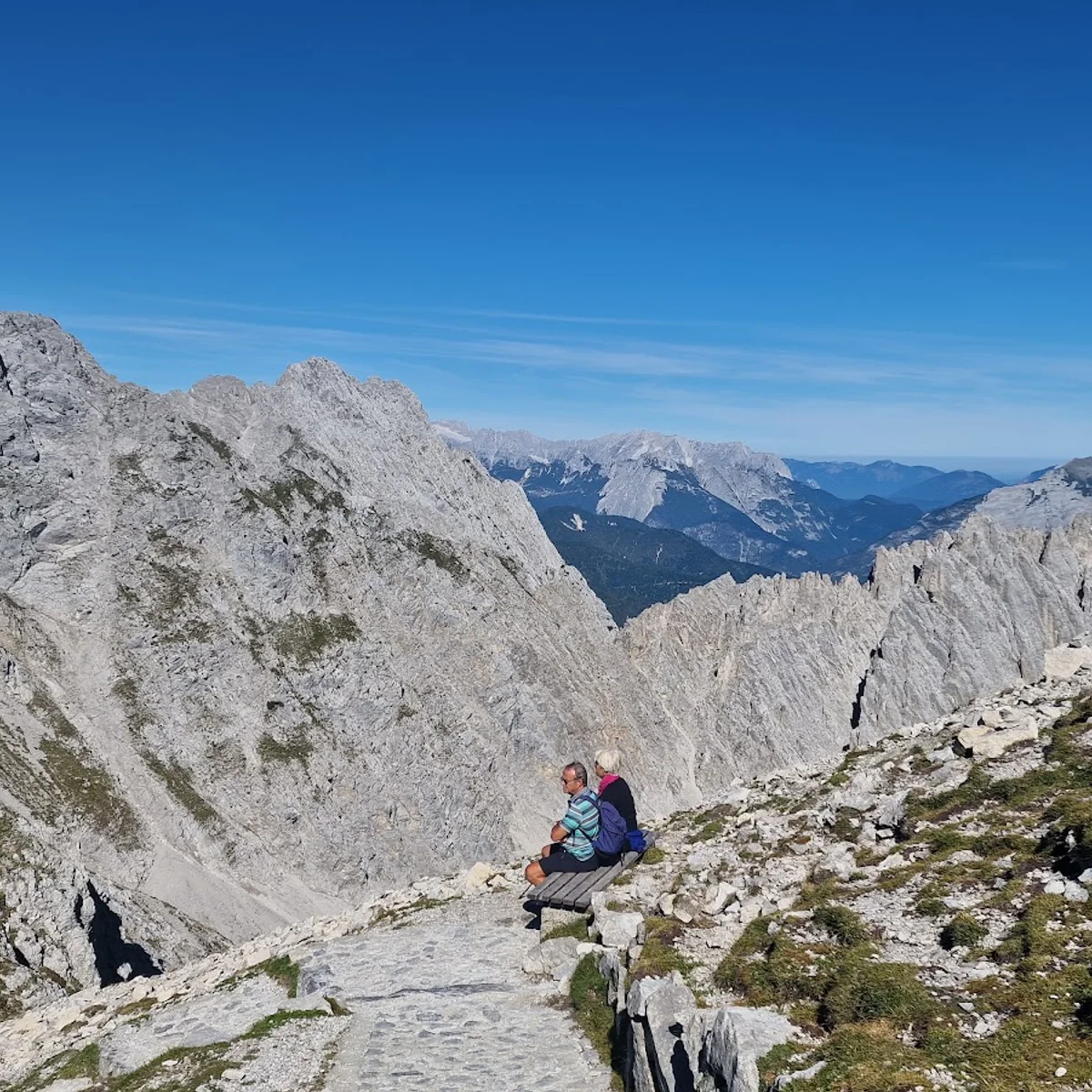 Serlesbahnen Mieders Bergbahn Bergstation in Austria - a person sitting on top of a mountain.