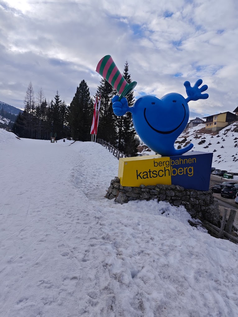 Katschberg in Austria - a blue whale statue on top of a snowy hill.