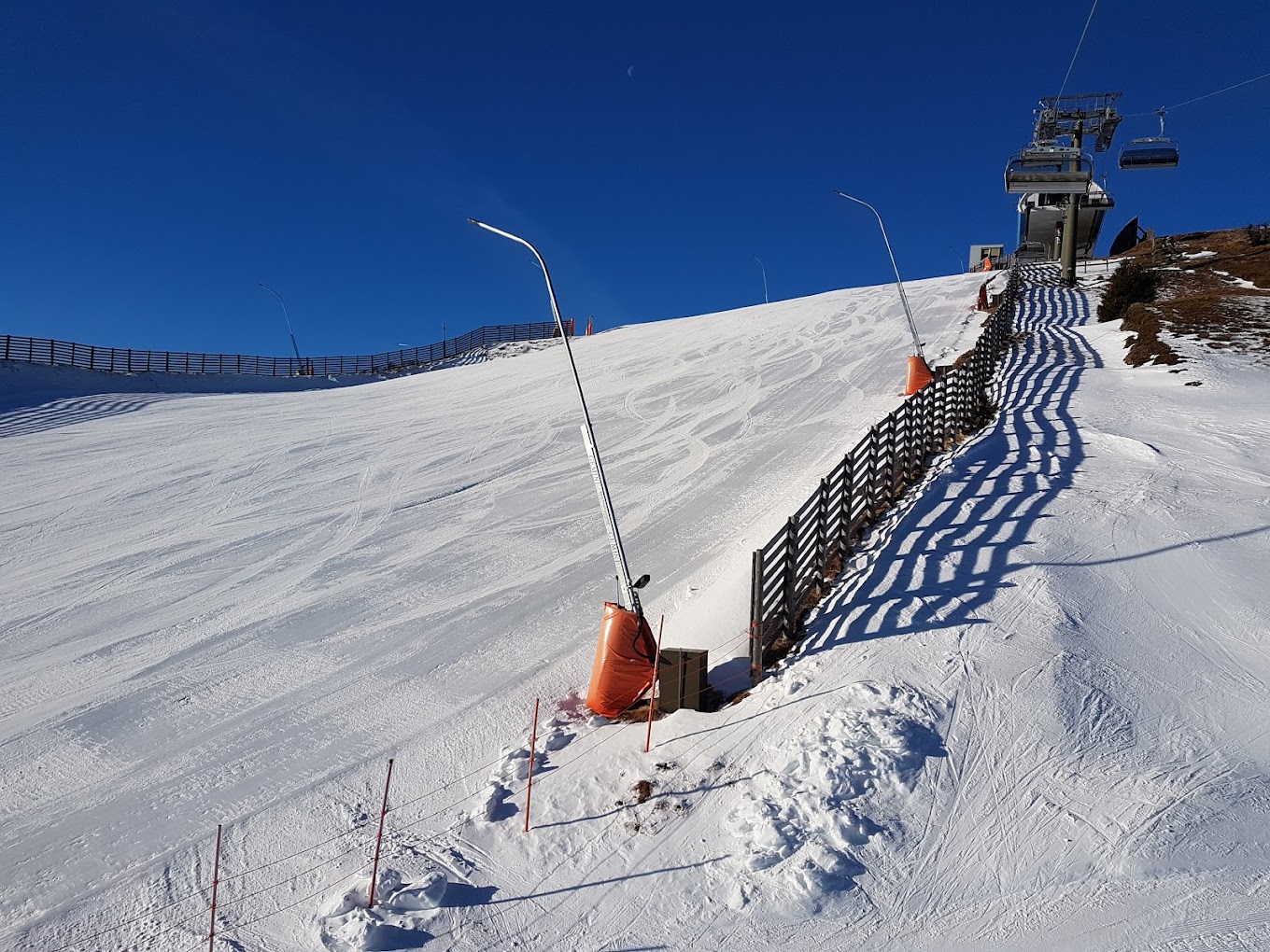 Katschberg in Austria - a ski lift going down a snowy slope.