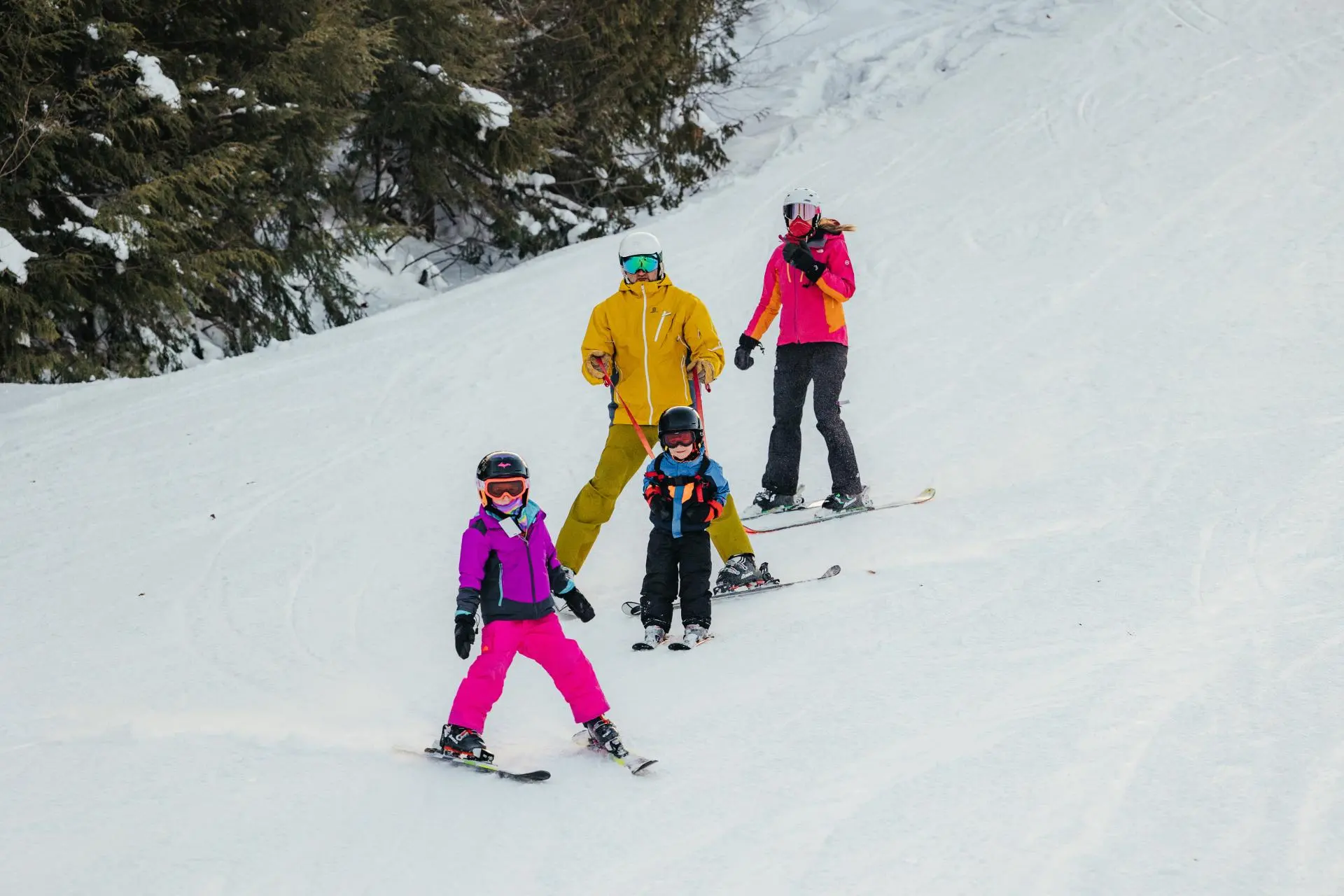 Family and group of people skiing on a beautiful day at Jackson Creek Summit in Wakefield Michigan bringing to life a vibrant winter sports scene at the ski resort.