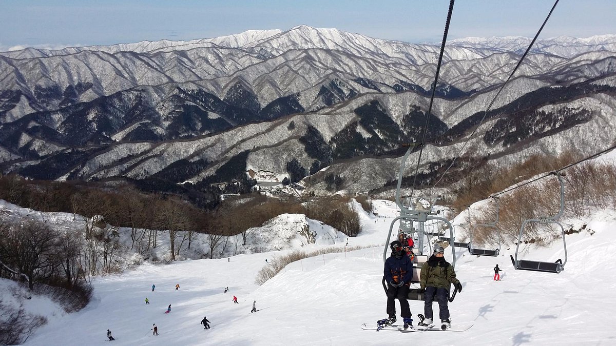 Okuibuki in Japan - a group of people riding a ski lift.