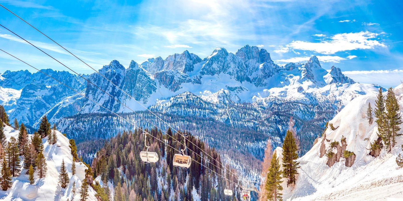 Camigliatello Silano in Italy - a ski lift going up a snowy mountain.
