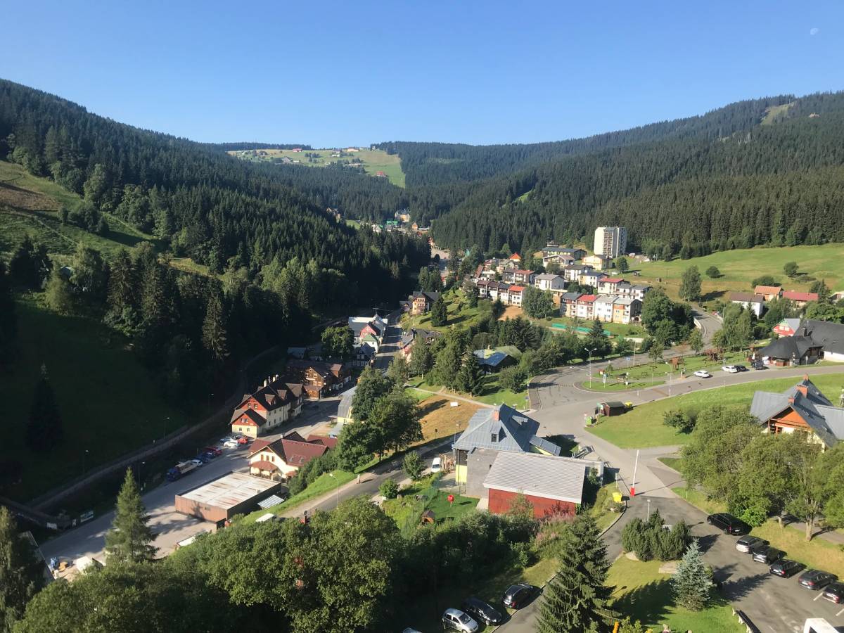 Ski center Říčky in Czech Republic - a view of the village from the top of a hill.