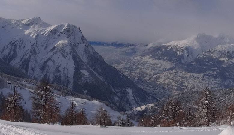 In this wintry scene from Rothwald a charming chalet nestled at the foot of a snow-covered Swiss mountain serves as the backdrop to a lively winter sports activity.