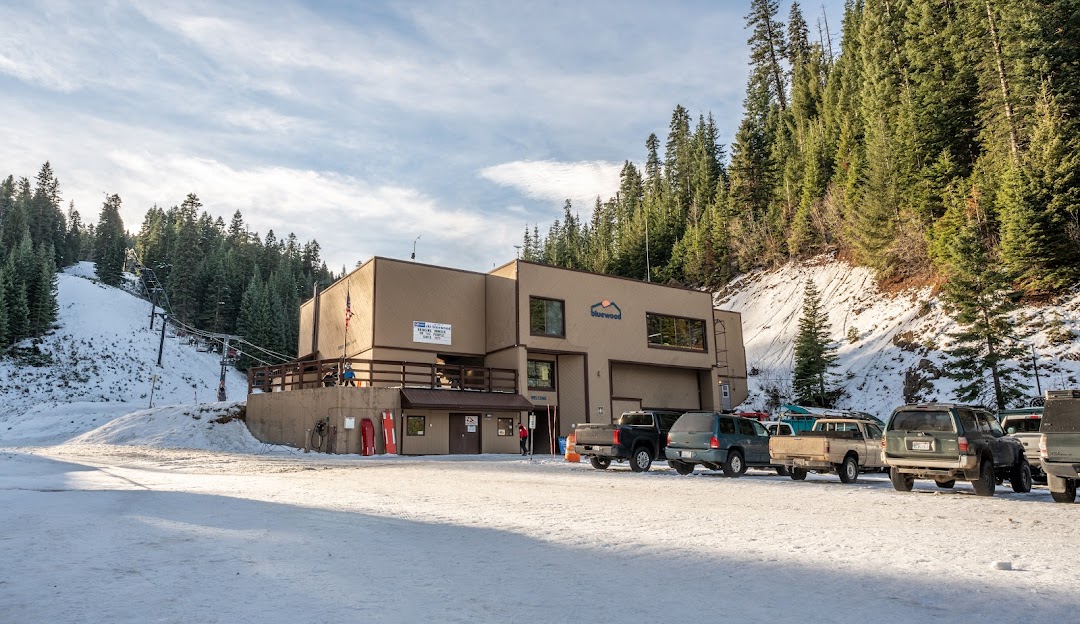 View of Bluewood ski resort in Dayton, Washington State, featuring a bustling lodge amid a captivating winter landscape known for winter sports.