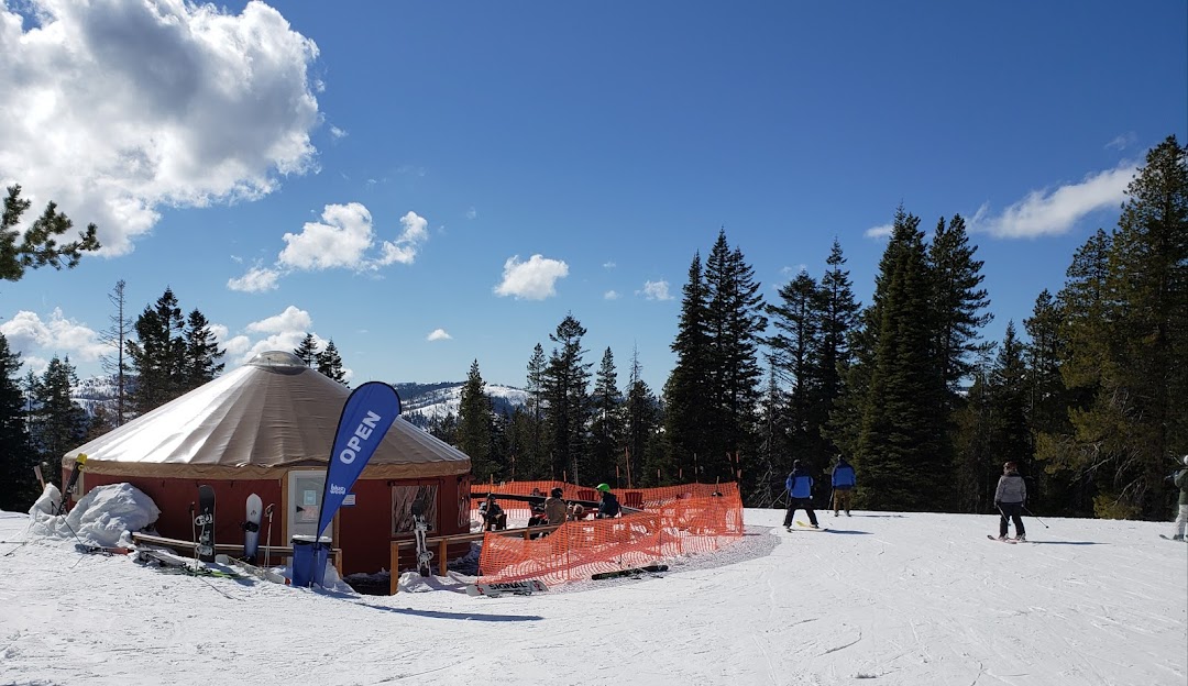 A scenic winter view at Bluewood ski resort in Dayton Washington State USA featuring a ski lift in operation skiers enjoying winter sports