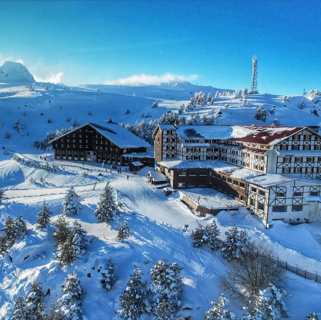 Kartalkaya in Turkey - an aerial view of a snowy village in the mountains.