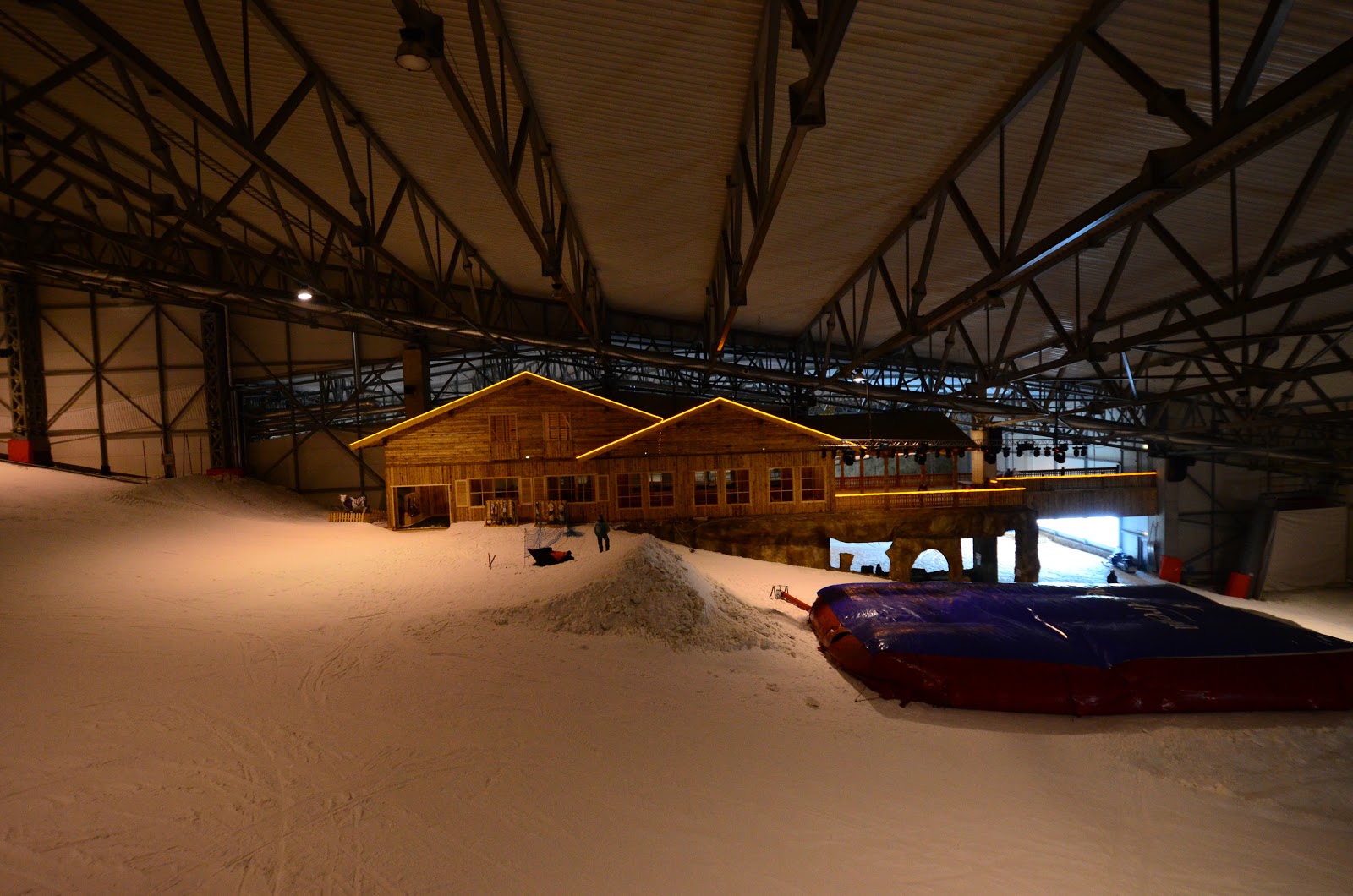 Snow Arena – Druskininkai in Lithuania - a car is parked in the snow in a garage.