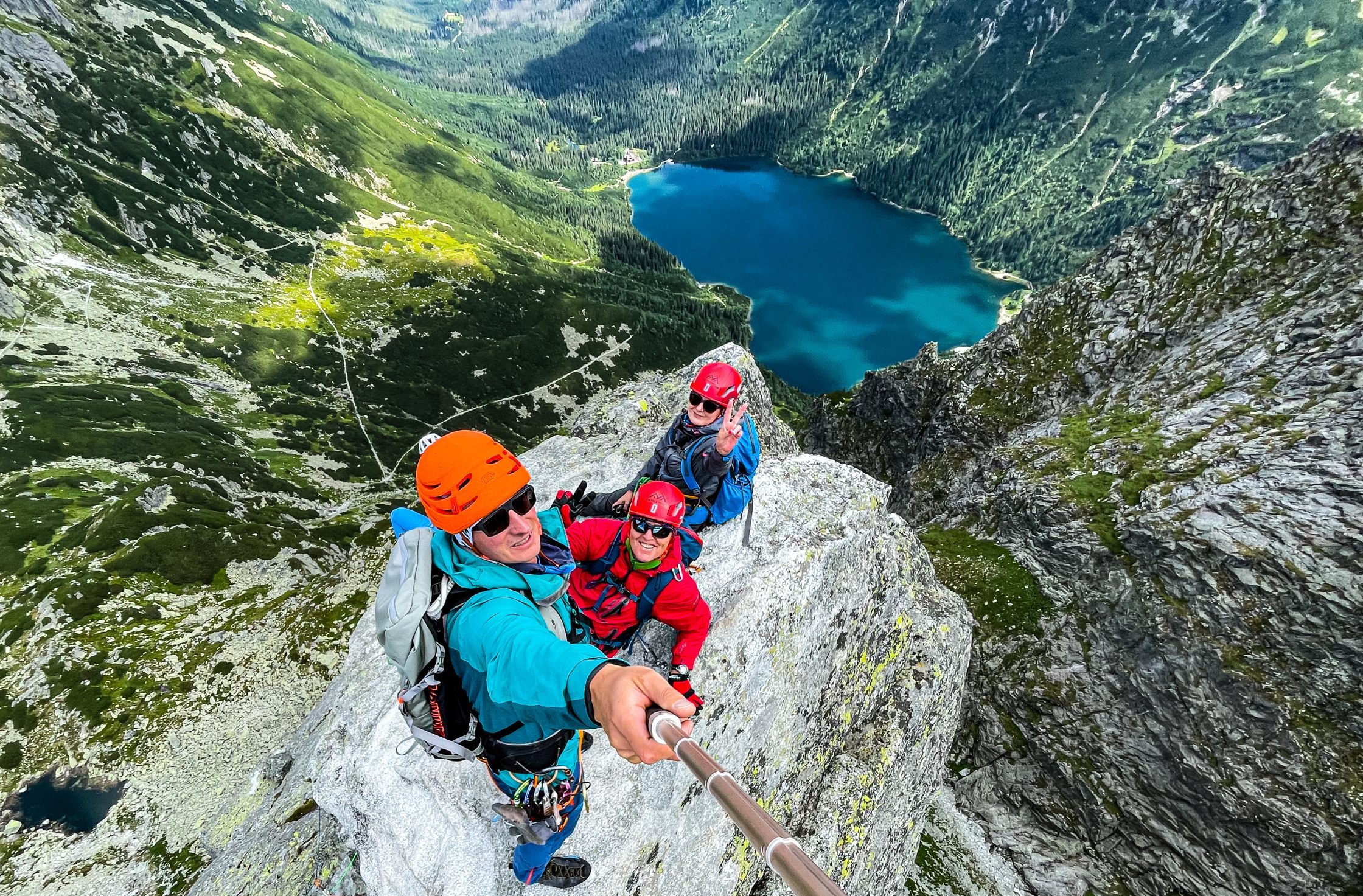 Kasprowy Wierch – Zakopane in Poland - a group of people climbing up the side of a mountain.