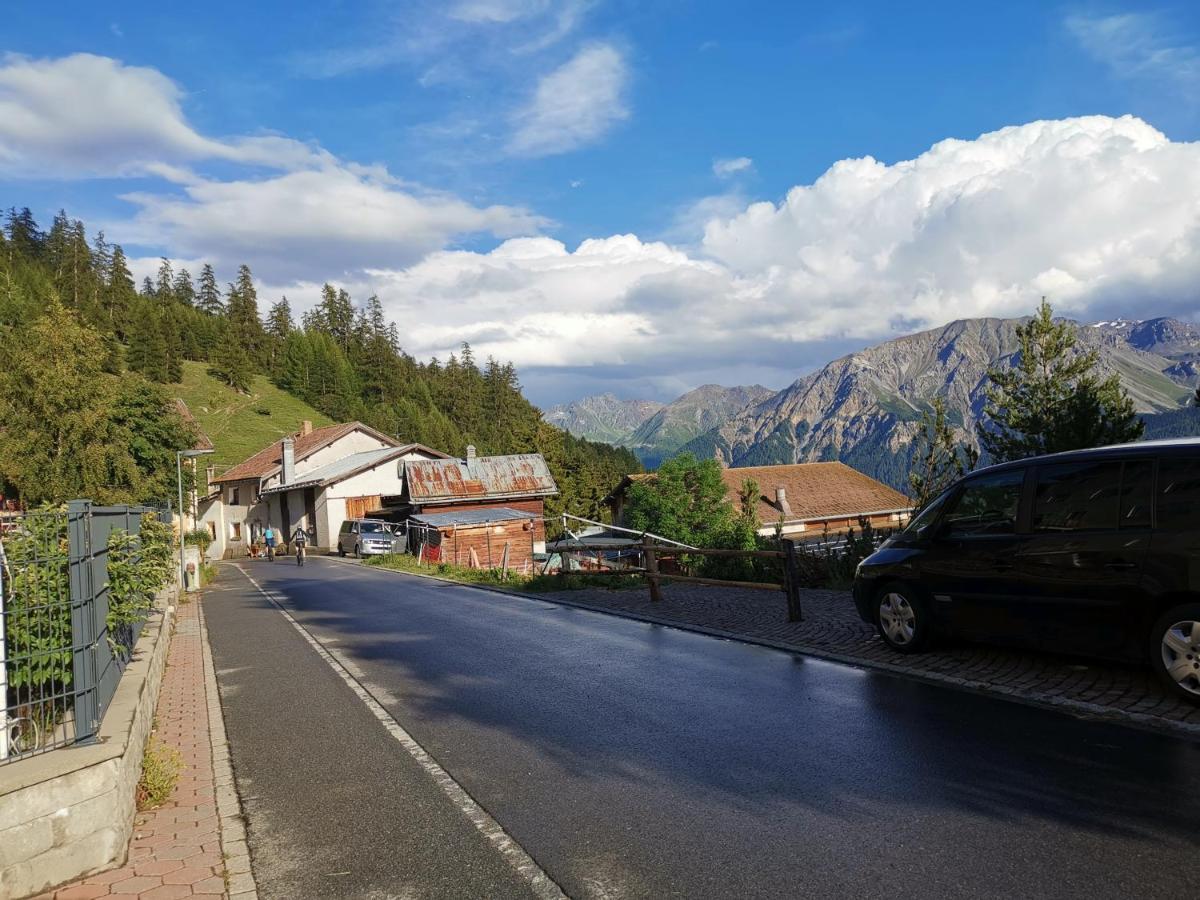 Skigebiet und Minschuns in Switzerland - a car parked on the side of a road.