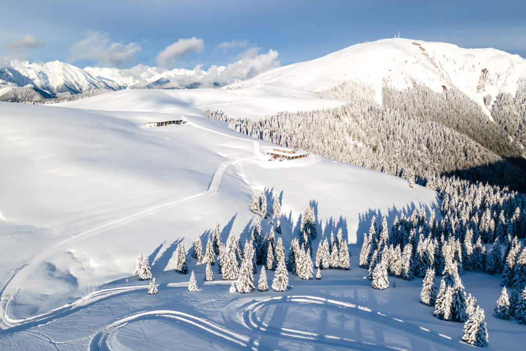 Winter scene at Monte Pora ski resort in Lombardy, Italy displaying snow-covered slopes amidst stunning winter scenery, common for winter sports enthusiasts.