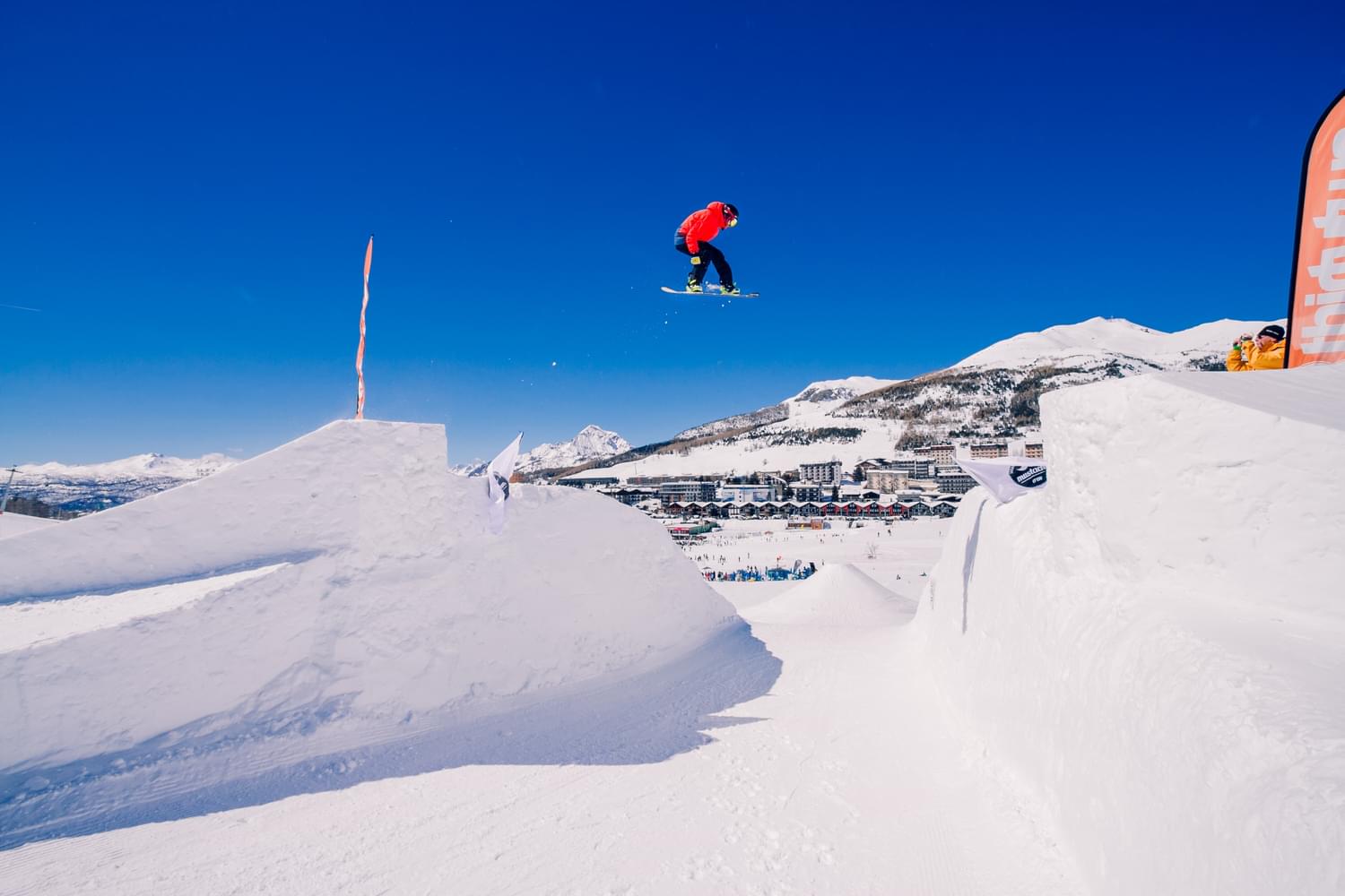Via Lattea in Italy - a person jumping in the air on a snowboard.