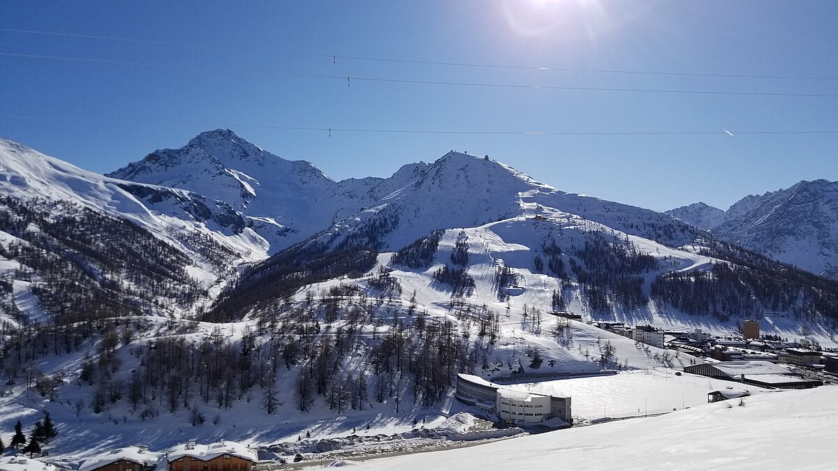 Via Lattea in Italy - the sun is shining over the snowy mountains.