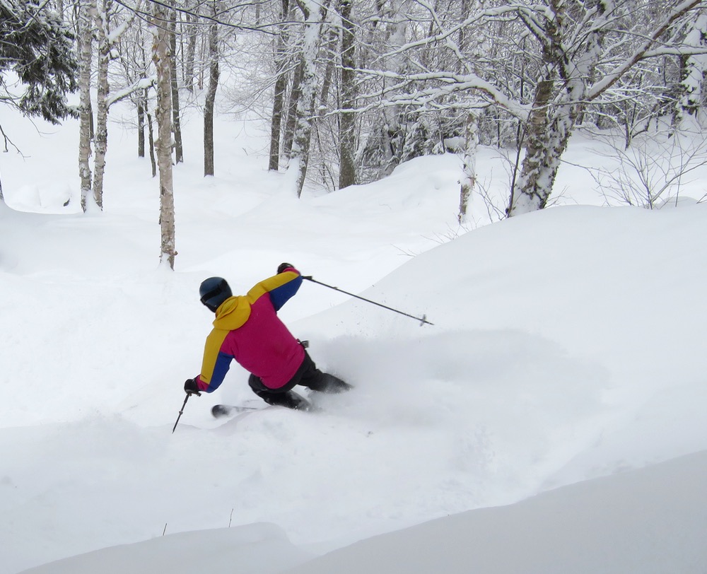 Ski La Réserve in Canada - a person skiing down a snow covered slope.