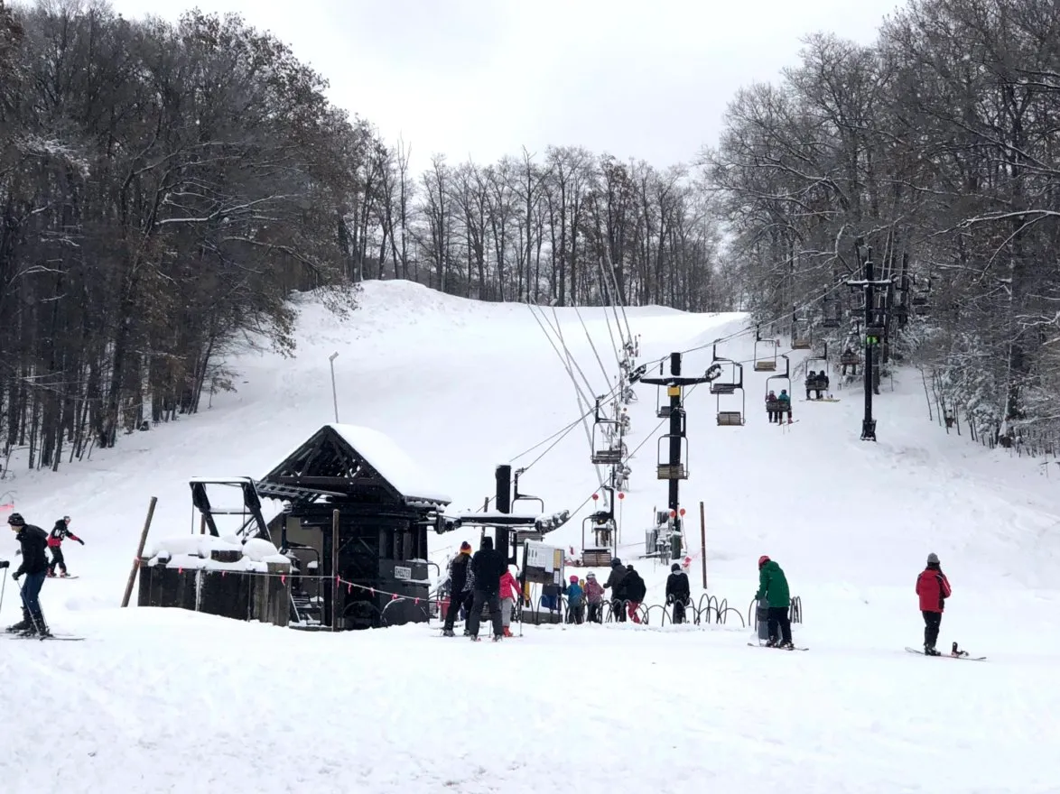 Caberfae Peaks in USA - a group of people standing in the snow.