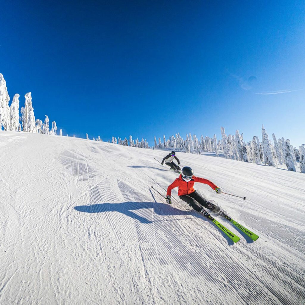 Tahko in Finland - a person skiing down a snow covered mountain.