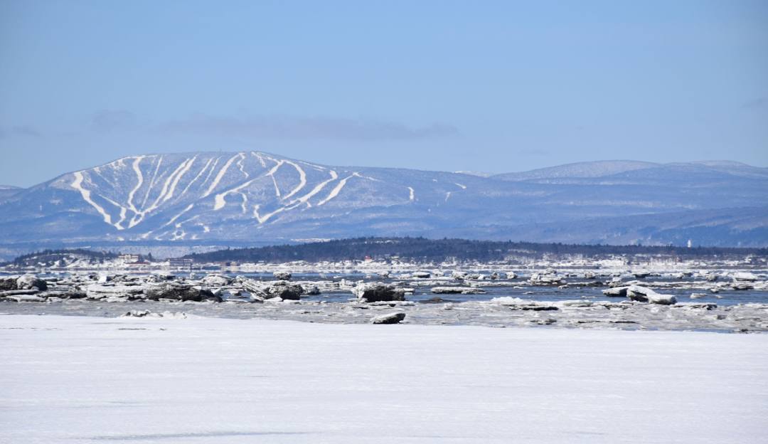 Mont-Sainte-Anne in Canada - a snowy landscape with mountains in the background.