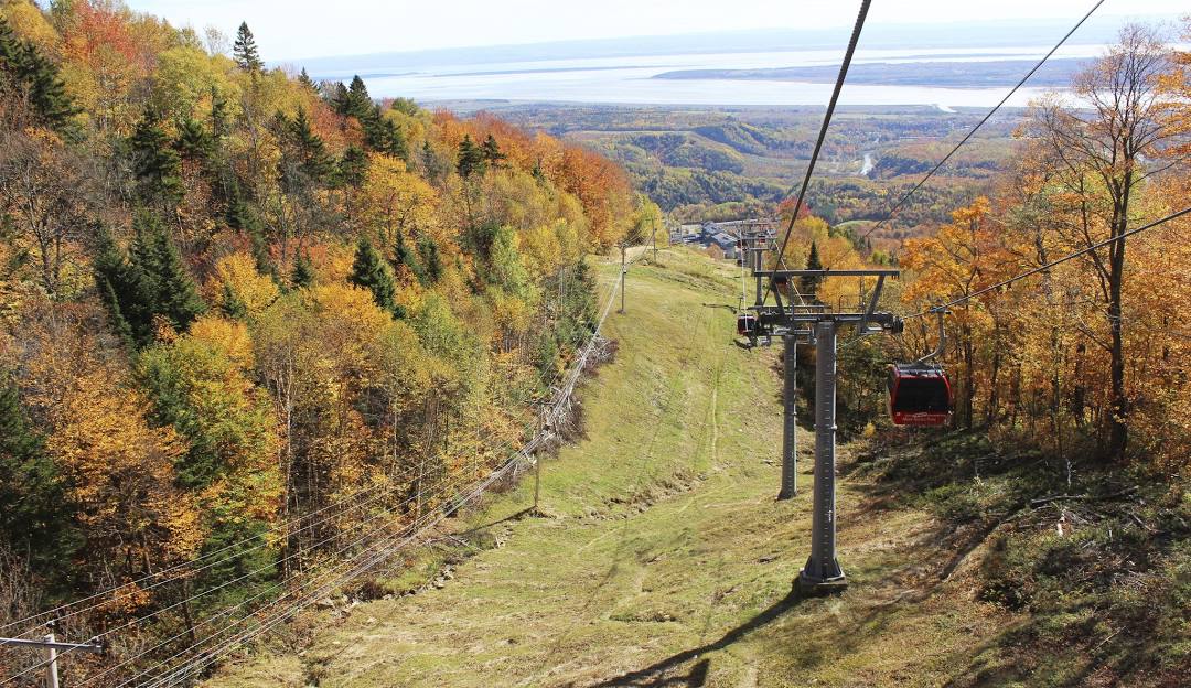 Mont-Sainte-Anne in Canada - a cable car going up the mountain in the fall.