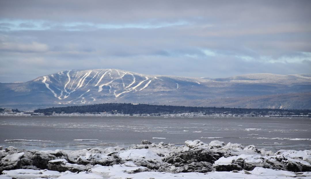 Mont-Sainte-Anne in Canada - snow covered mountains in the distance.