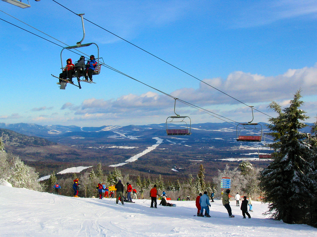 Mont-Sainte-Anne in Canada - a group of people riding a ski lift.