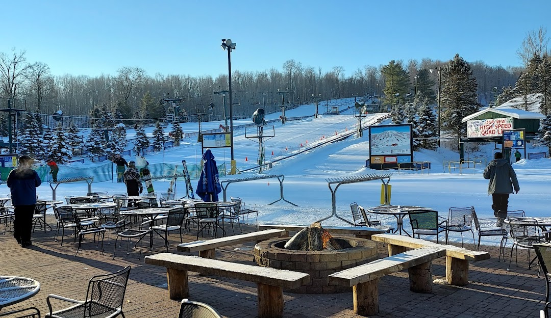Winter sports enthusiasts enjoy the snowy slopes at Bittersweet ski resort in Otsego, Michigan, a popular winter sports destination in the USA.
