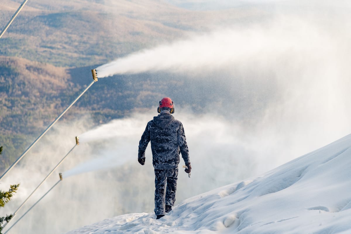 Killington in USA - a man walking up a snow covered mountain.