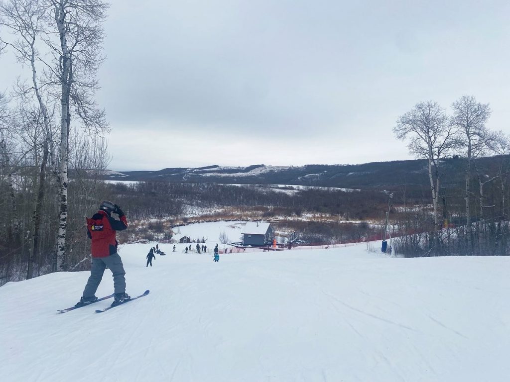 Asessippi in Canada - a person on a snowboard in the snow.