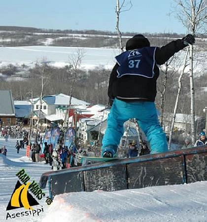 A snowboarder gliding down the slopes at Asessippi Inglis Manitoba Canada