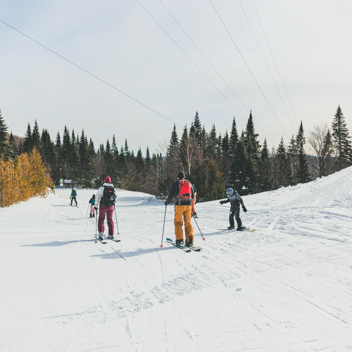Ski Garceau in Canada - a group of people skiing down a snow covered hill.