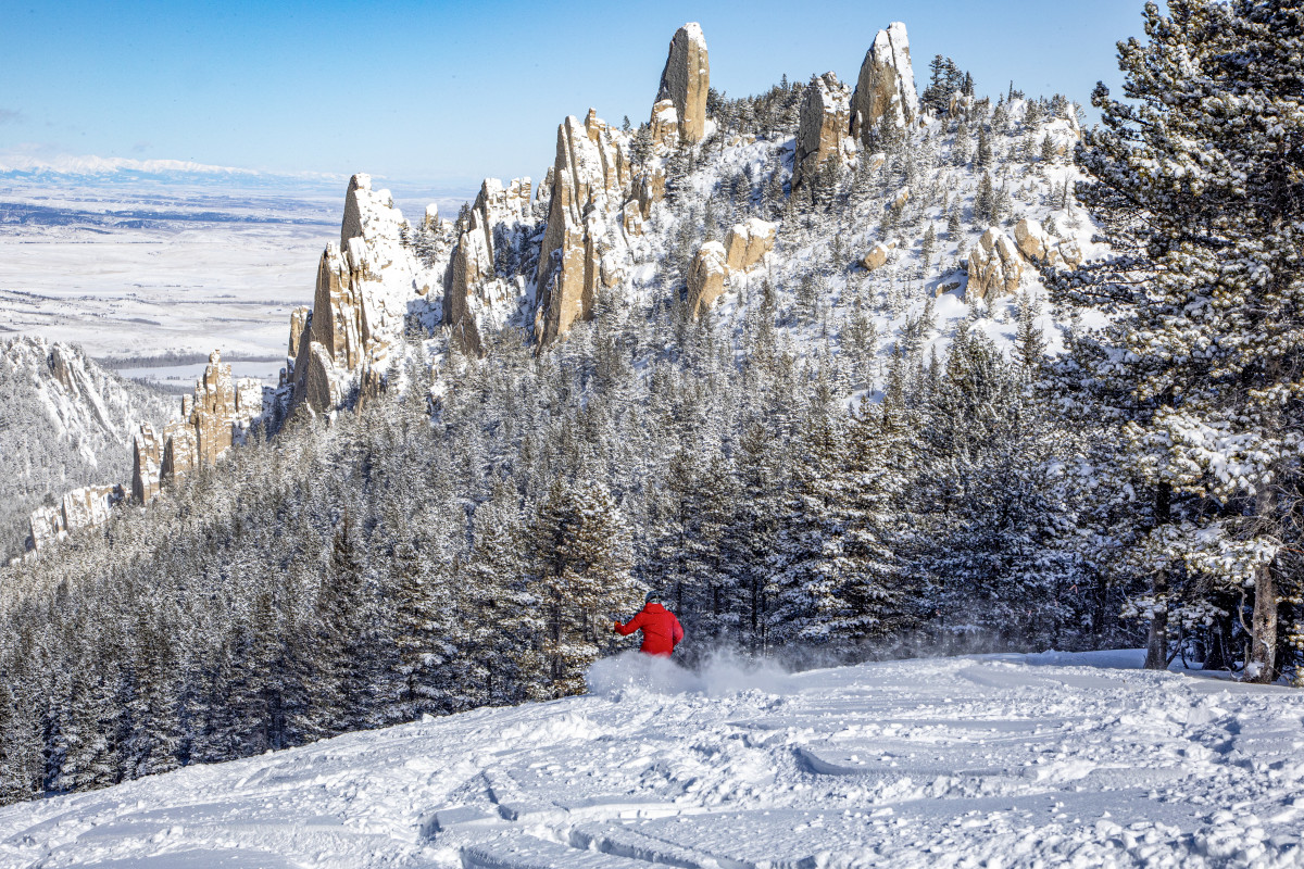 Mt Bohemia in USA - a person standing on top of a snow covered mountain.
