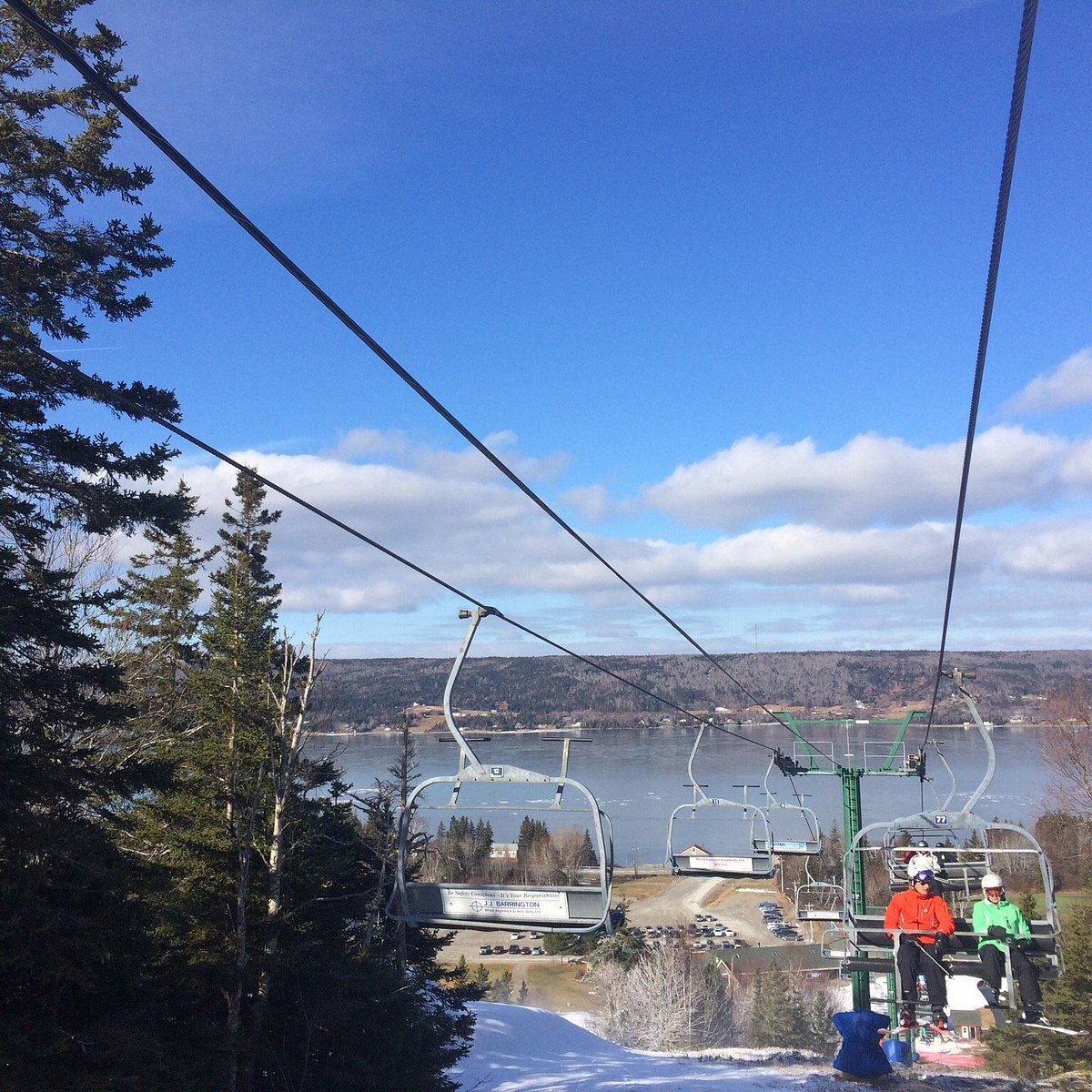Ben Eoin in Canada - a couple of people riding a ski lift.
