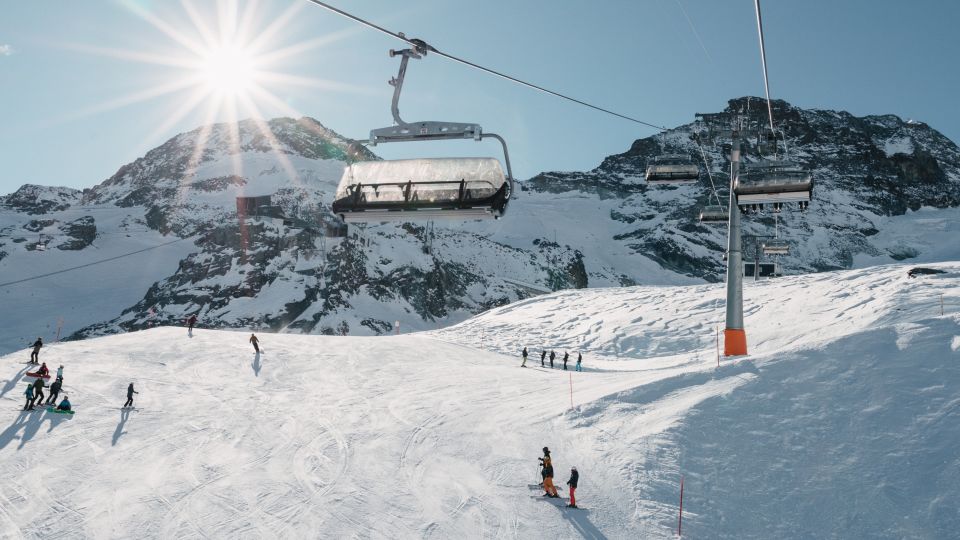 Heidbodme – Saas-Almagell in Switzerland - a group of people skiing down a mountain.