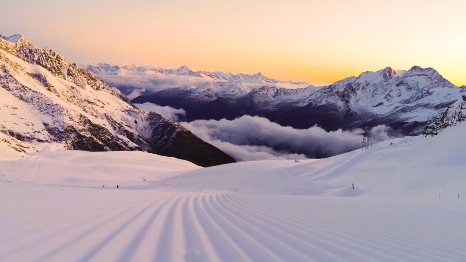 Heidbodme – Saas-Almagell in Switzerland - the sun is setting on the snowy mountains.